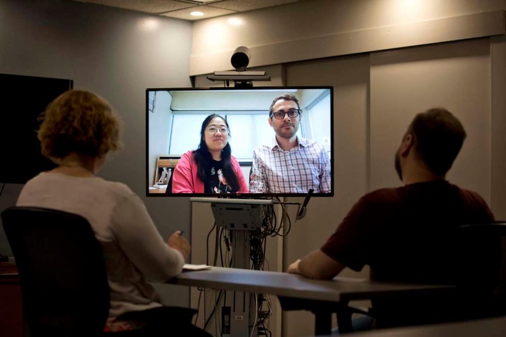 two people speaking with cmh staff over video