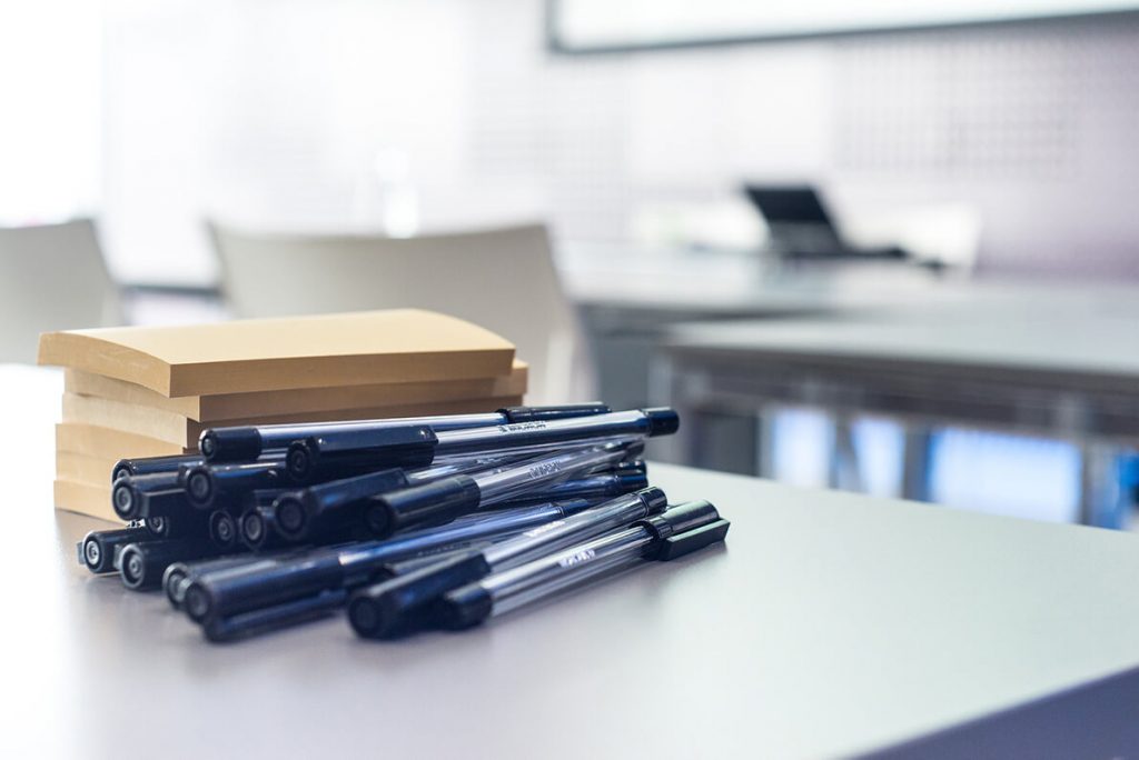 Still life photo of pens and notes