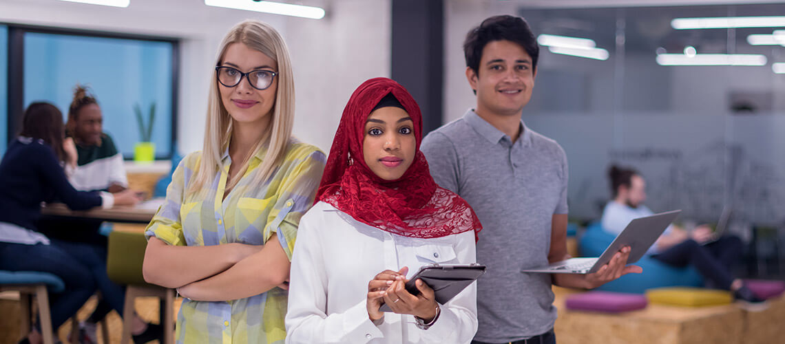 3 diverse grad students in a college lounge/ study centre