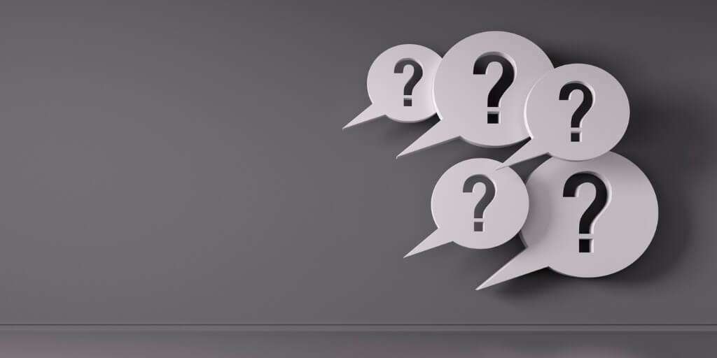 Holding difficult conversations image with question marks in speech bubbles