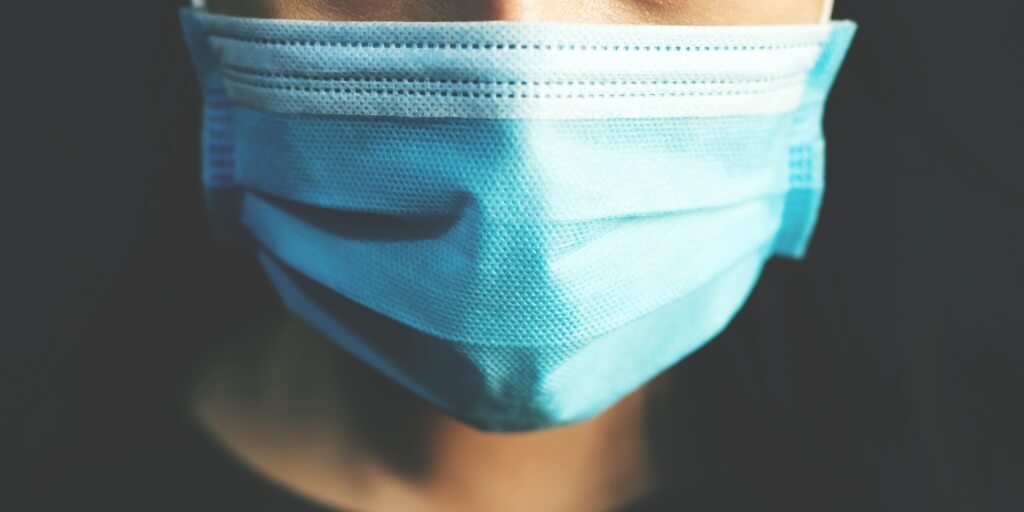 image of person wearing a face mask
