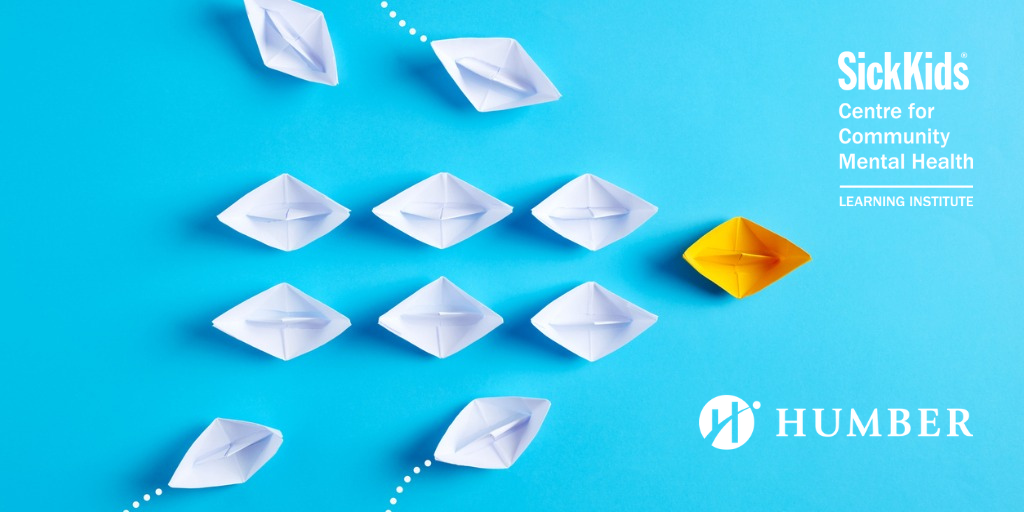 paper boats with one yellow leading the way