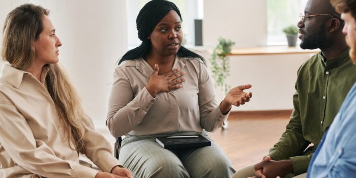 image of people connecting and talking using debriefing skills