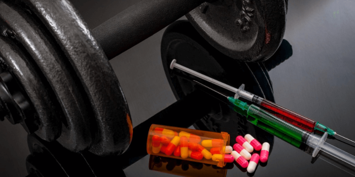 image of a dumbbell, pills, needles for appearance and performance-enhancing drugs training