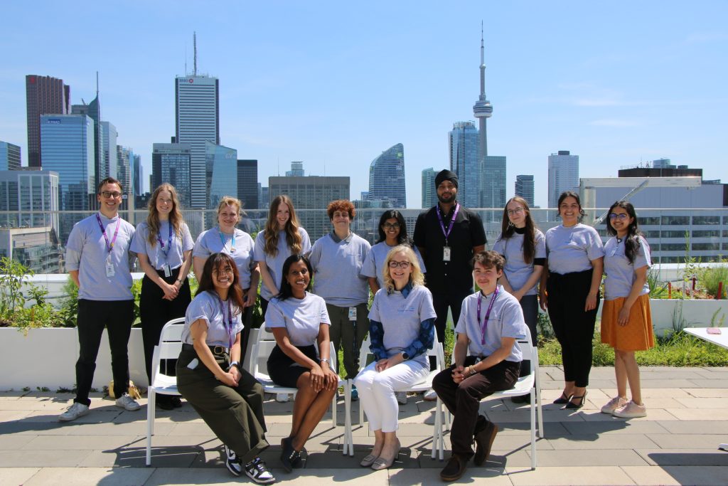 Thriving Minds Working Group on rooftop overlooking CN tower