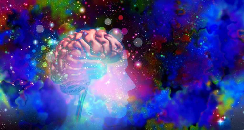 Abstract training image for psychedelic integration, showing a human profile, brain, and vivid multicoloured background.