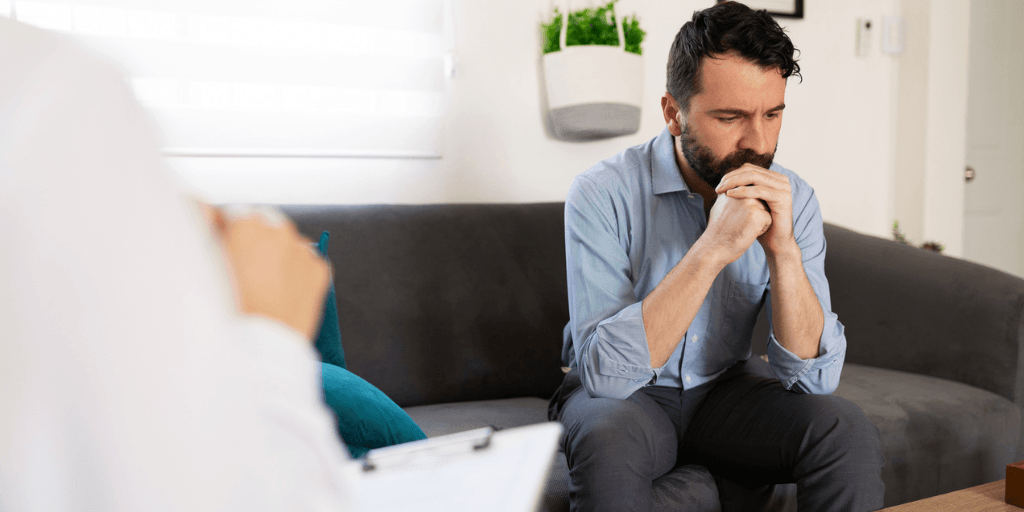 Two people in a therapy session for dissociation in trauma therapy
