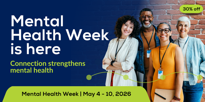 Group of professionals smiling at camera for mental health week