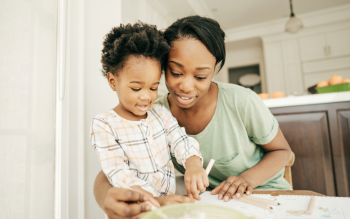 Mom and daughter drawing together
